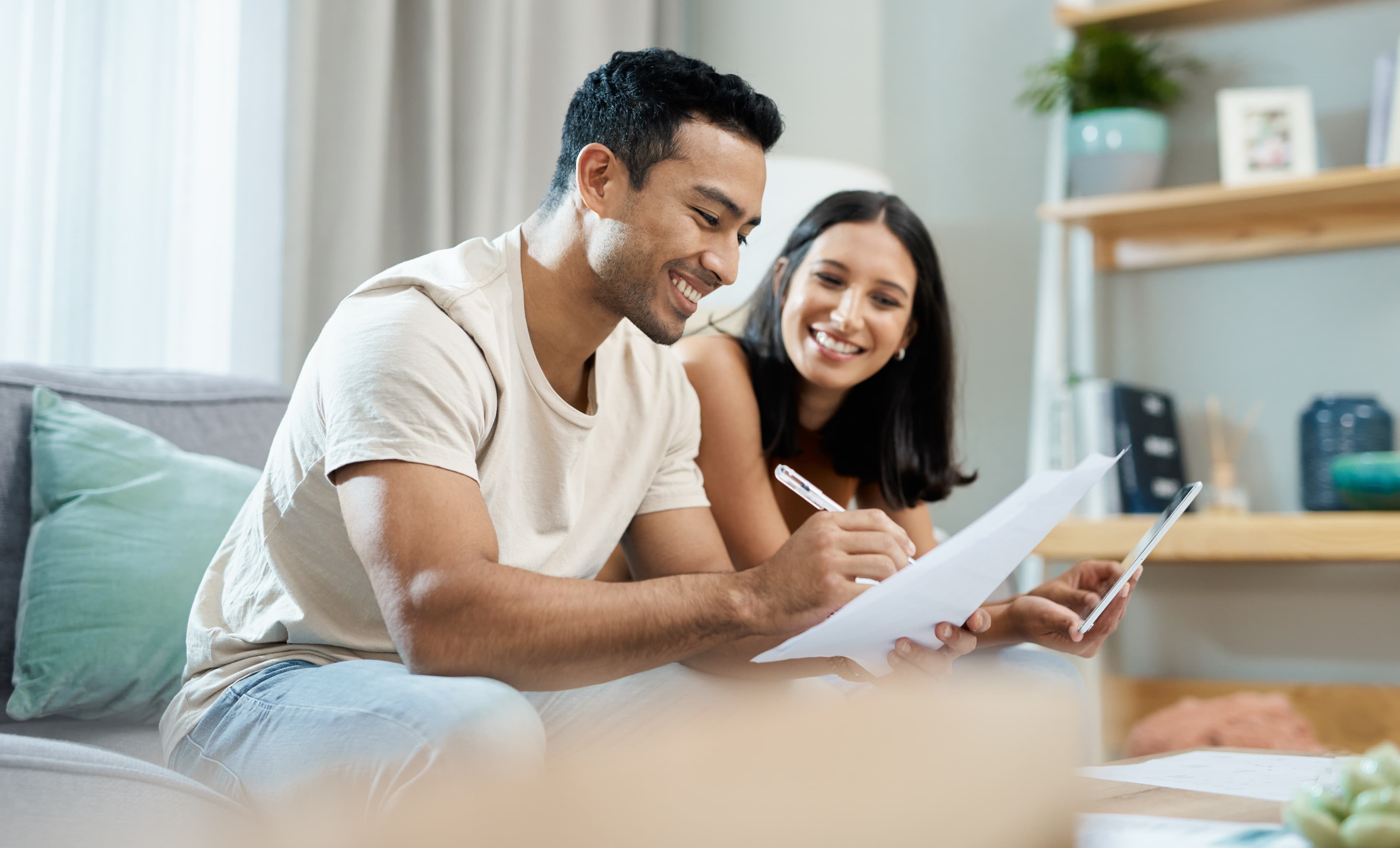 Picture of a happy couple looking at 0% financing options.